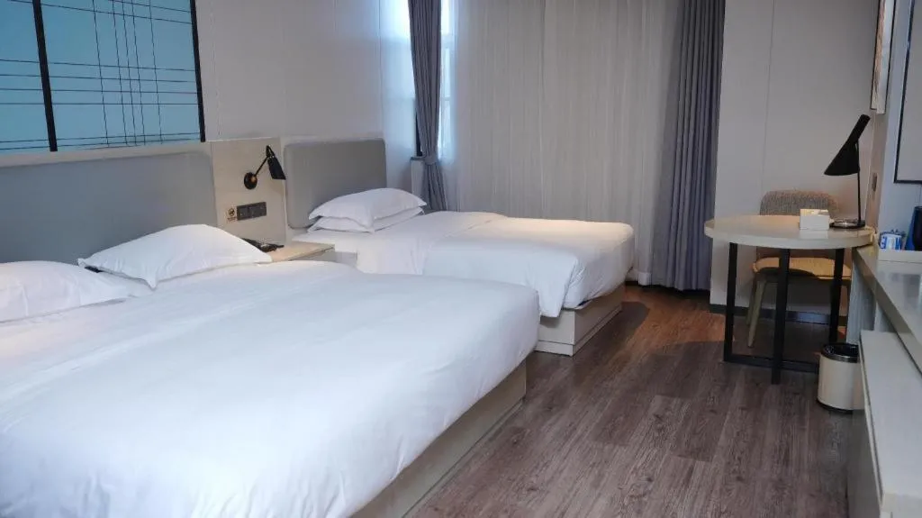 Bed in Echarm Hotel Changsha Guihua Park Metro Station