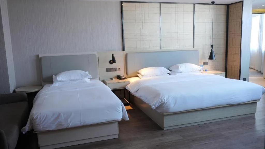 Bed in Echarm Hotel Changsha Guihua Park Metro Station
