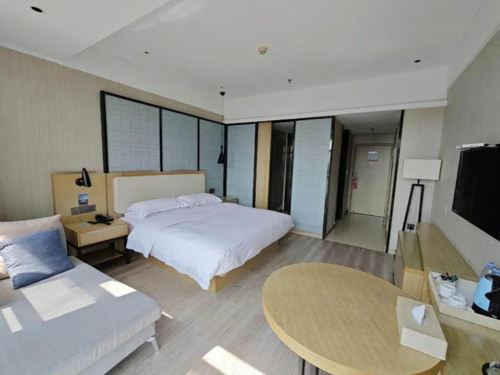 Bed in Echarm Hotel Xinyu Railway Station Baoshi Park