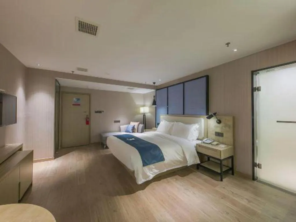 Bed in Echarm Hotel Xinyu Railway Station Baoshi Park