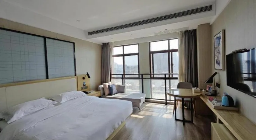 Bed in Echarm Hotel Xinyu Railway Station Baoshi Park