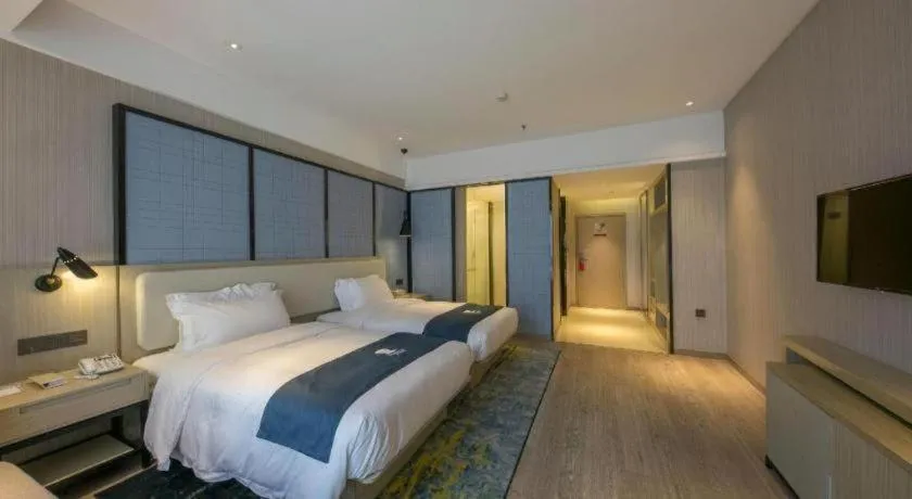 Bed in Echarm Hotel Xinyu Railway Station Baoshi Park