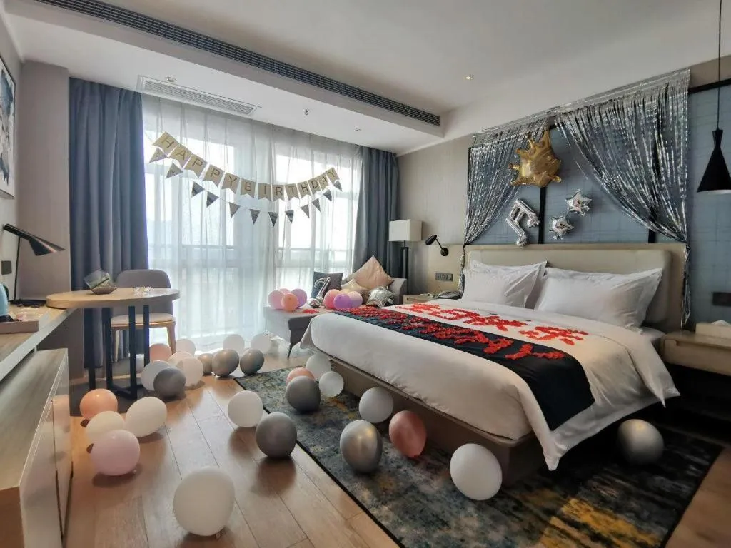 Bed in Echarm Hotel Xinyu Railway Station Baoshi Park