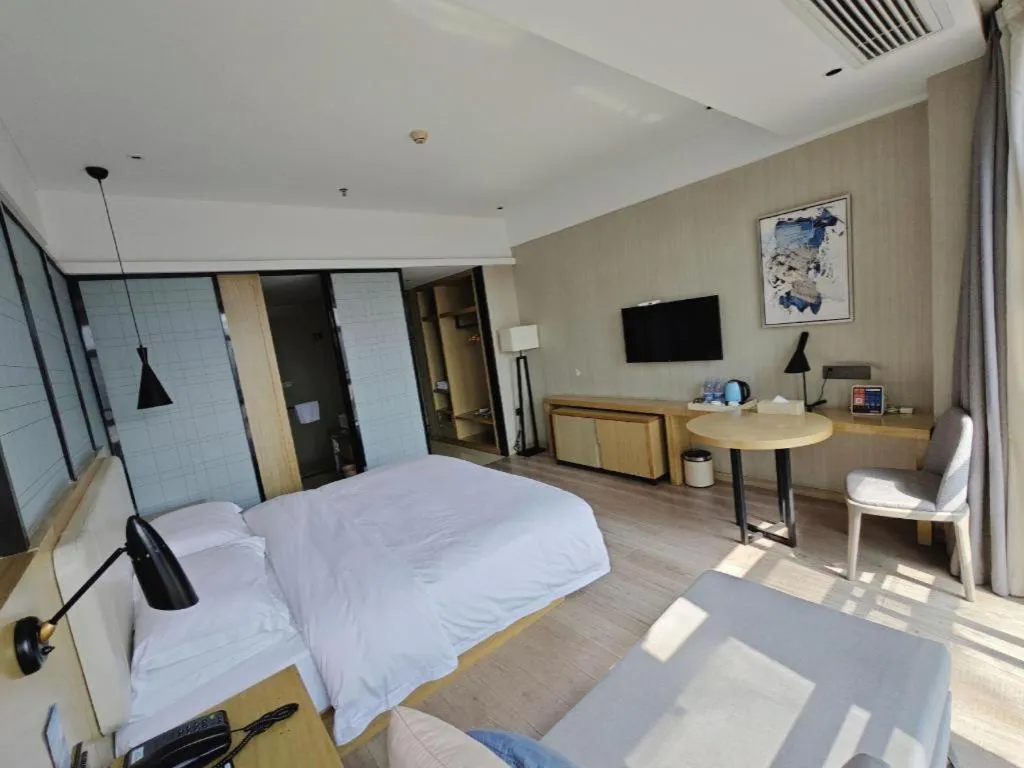 Bed in Echarm Hotel Xinyu Railway Station Baoshi Park