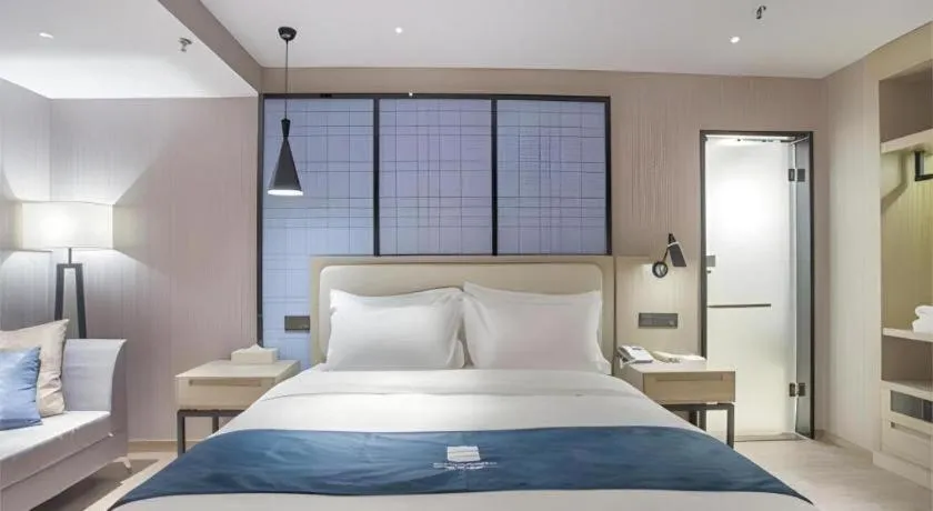 Bed in Echarm Hotel Xinyu Railway Station Baoshi Park