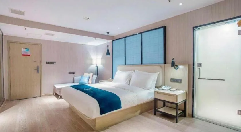 Bed in Echarm Hotel Xinyu Railway Station Baoshi Park