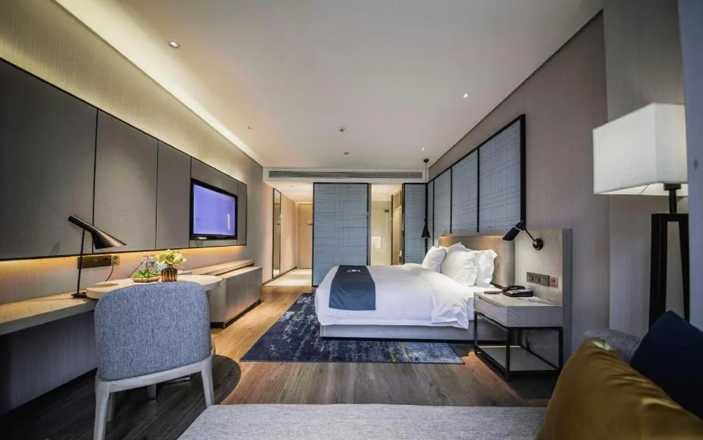 Bed in Echarm Hotel Xinyu Railway Station Baoshi Park