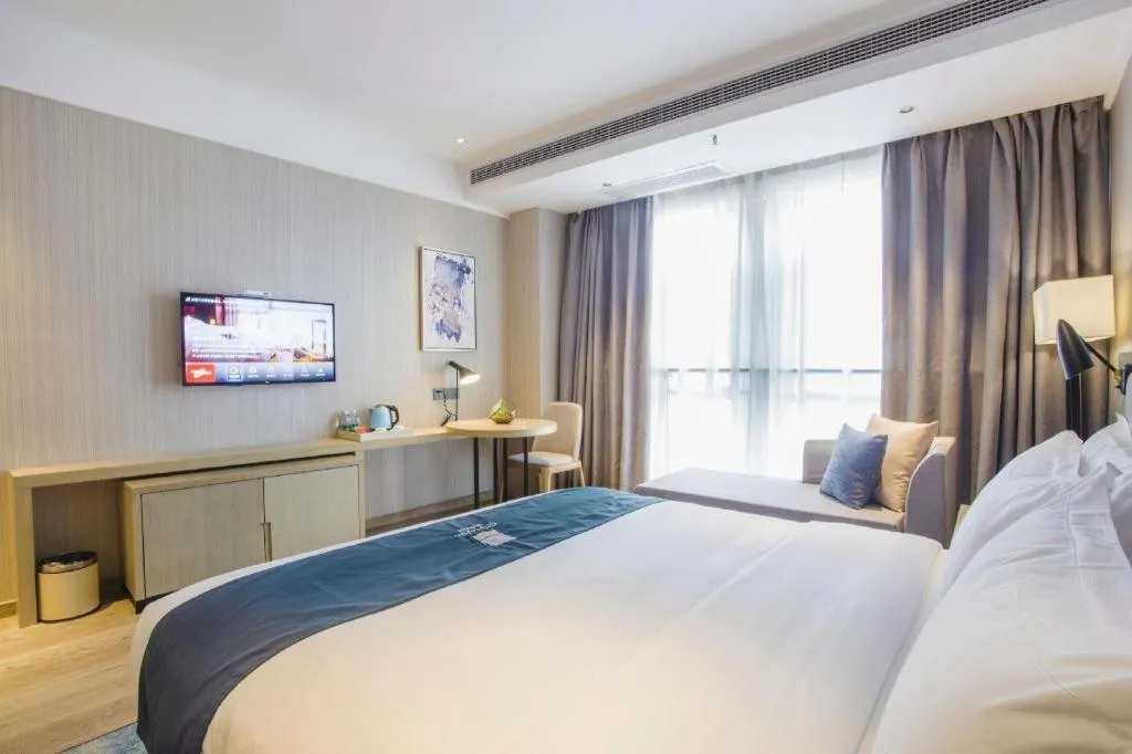 Bed in Echarm Hotel Xinyu Railway Station Baoshi Park