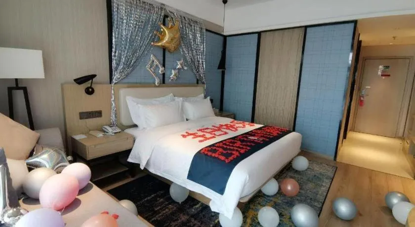 Bed in Echarm Hotel Xinyu Railway Station Baoshi Park