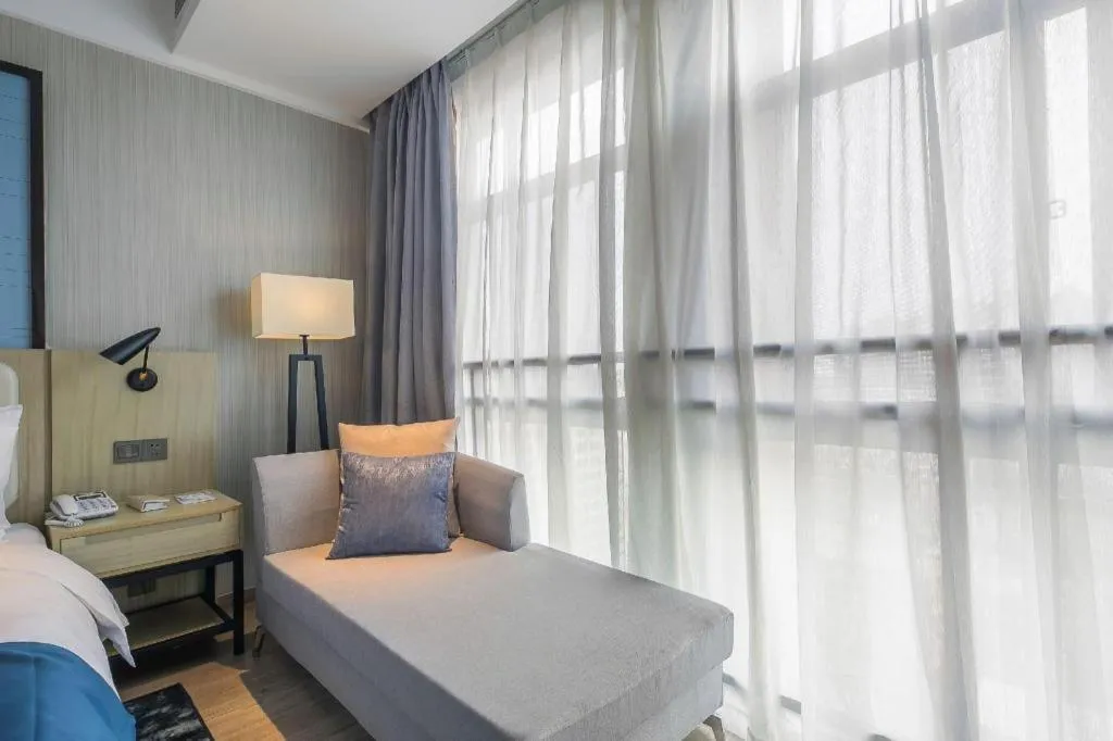 Bed in Echarm Hotel Xinyu Railway Station Baoshi Park