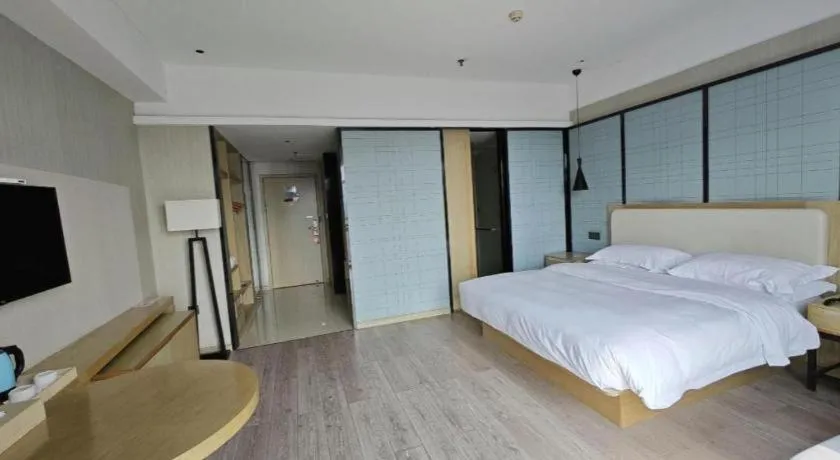 Bed in Echarm Hotel Xinyu Railway Station Baoshi Park