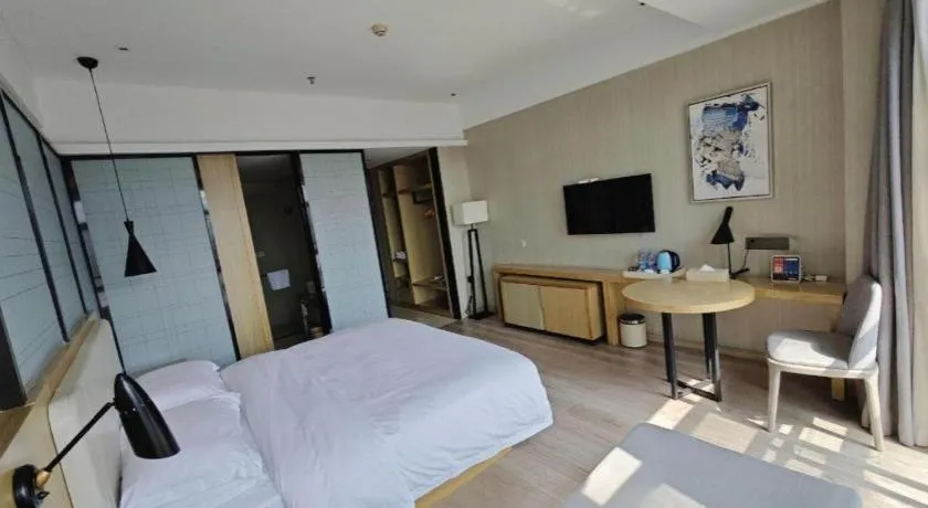 Bed in Echarm Hotel Xinyu Railway Station Baoshi Park