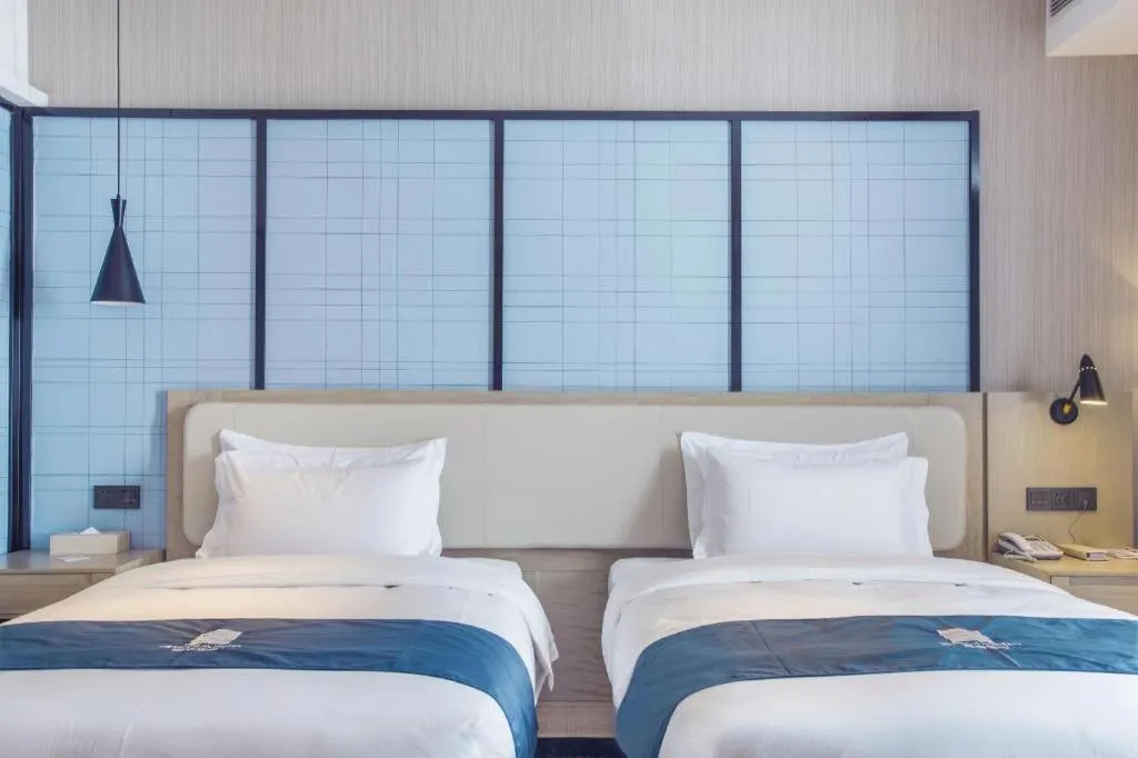 Bed in Echarm Hotel Xinyu Railway Station Baoshi Park