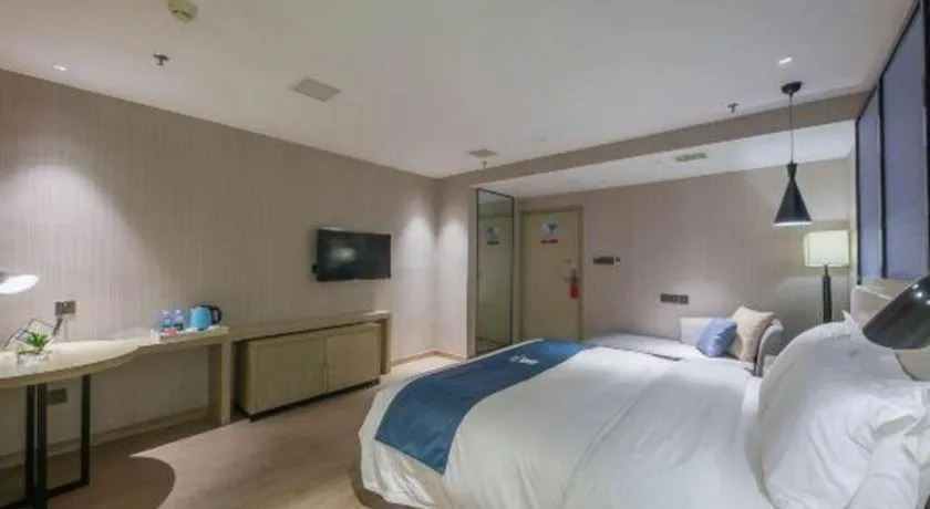 Bed in Echarm Hotel Xinyu Railway Station Baoshi Park