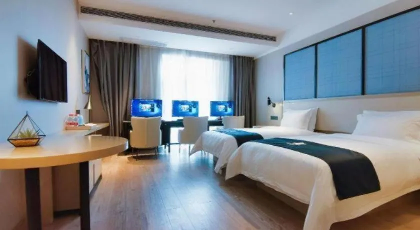 Bed in Echarm Hotel Xinyu Railway Station Baoshi Park