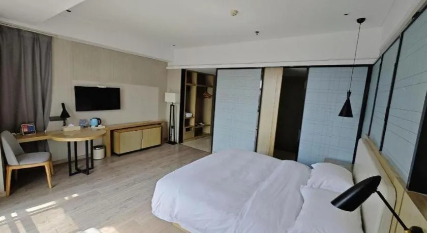 Bed in Echarm Hotel Xinyu Railway Station Baoshi Park