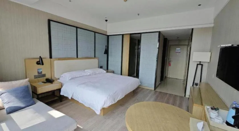 Bed in Echarm Hotel Xinyu Railway Station Baoshi Park