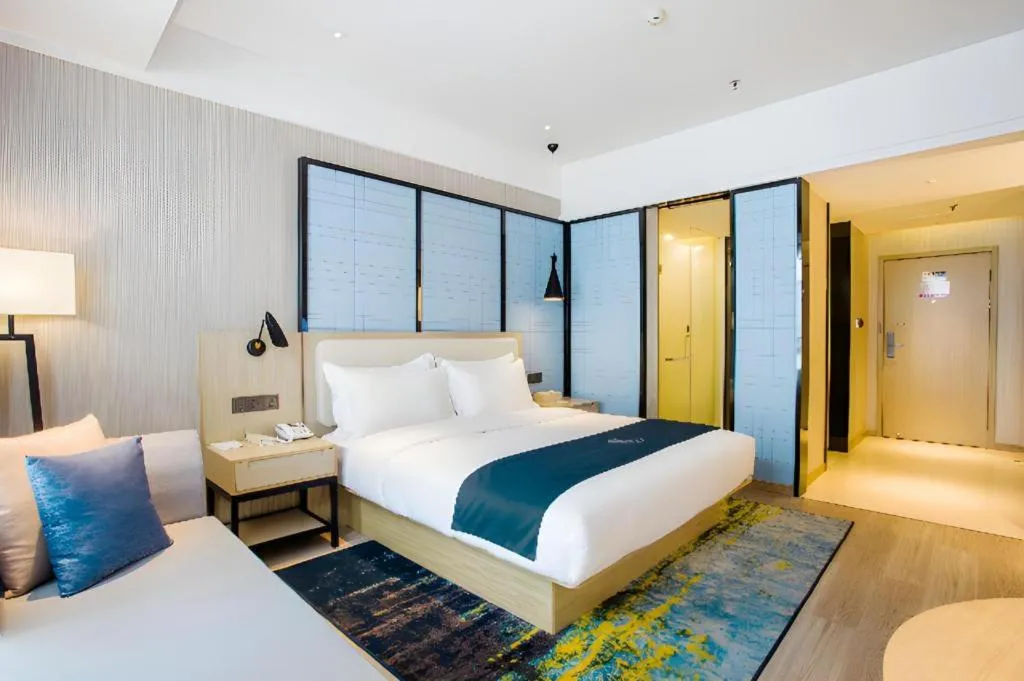 Bed in Echarm Hotel Xinyu Railway Station Baoshi Park