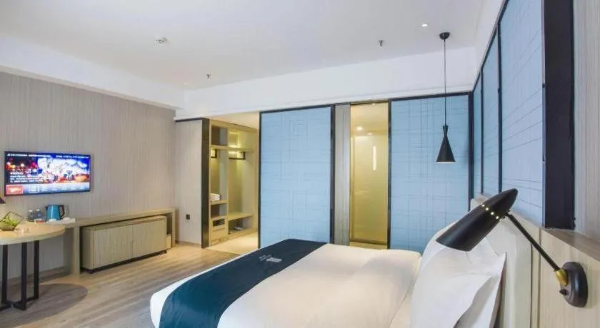 Bed in Echarm Hotel Xinyu Railway Station Baoshi Park