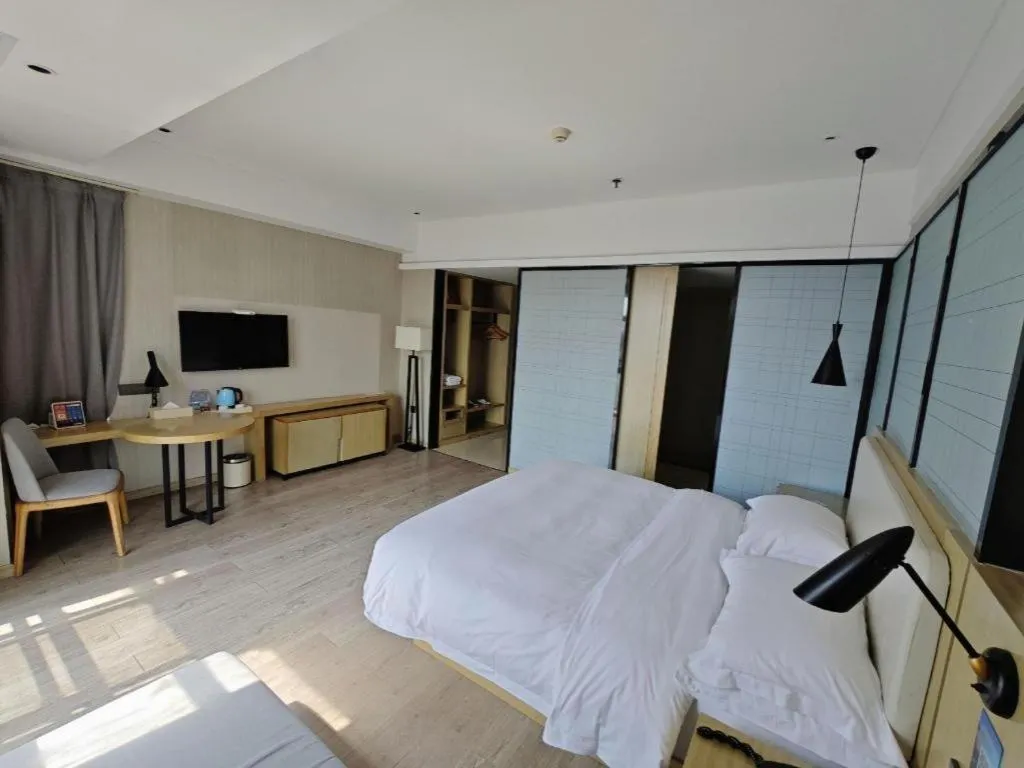 Bed in Echarm Hotel Xinyu Railway Station Baoshi Park