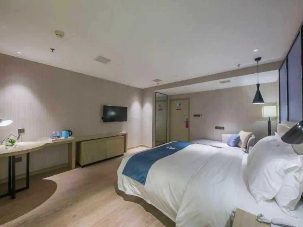 Bed in Echarm Hotel Xinyu Railway Station Baoshi Park