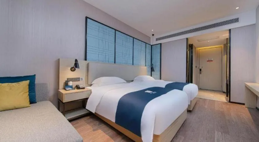 Bed in Echarm Hotel Xinyu Railway Station Baoshi Park