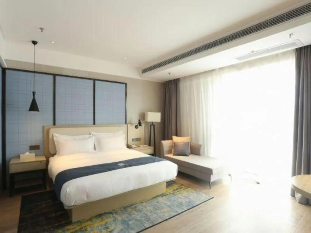 Bed in Echarm Hotel Xinyu Railway Station Baoshi Park