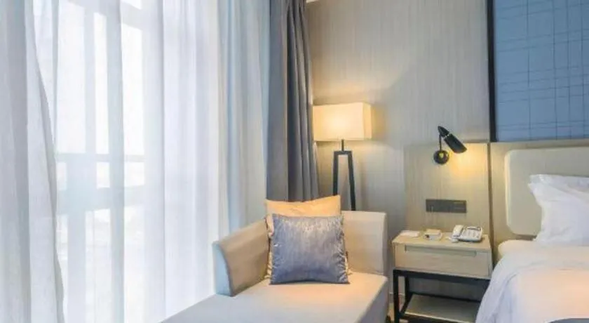 Bed in Echarm Hotel Xinyu Railway Station Baoshi Park