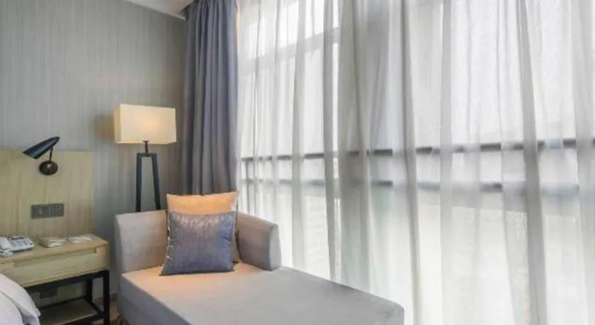 Bed in Echarm Hotel Xinyu Railway Station Baoshi Park