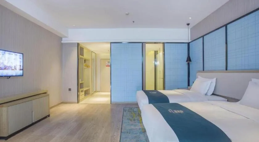 Bed in Echarm Hotel Xinyu Railway Station Baoshi Park