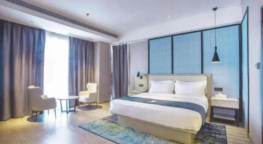 Bed in Echarm Hotel Xinyu Railway Station Baoshi Park