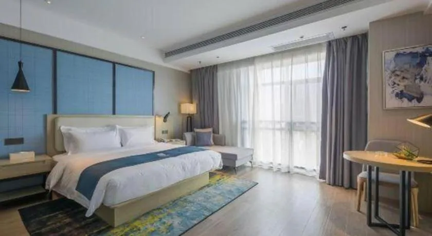 Bed in Echarm Hotel Xinyu Railway Station Baoshi Park