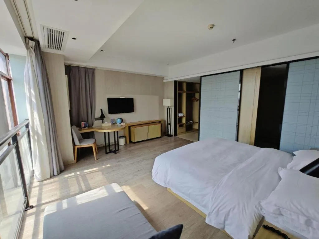 Bed in Echarm Hotel Xinyu Railway Station Baoshi Park