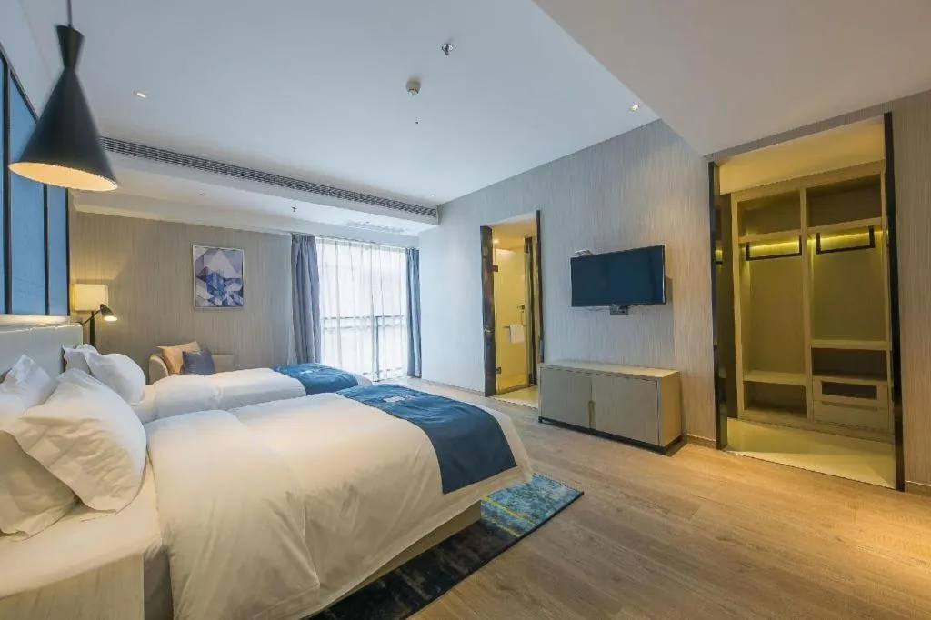 Bed in Echarm Hotel Xinyu Railway Station Baoshi Park