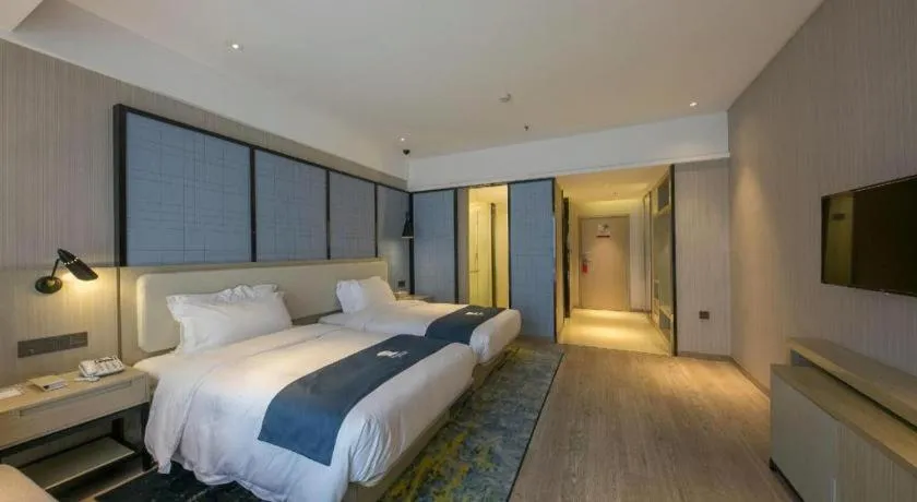 Bed in Echarm Hotel Xinyu Railway Station Baoshi Park