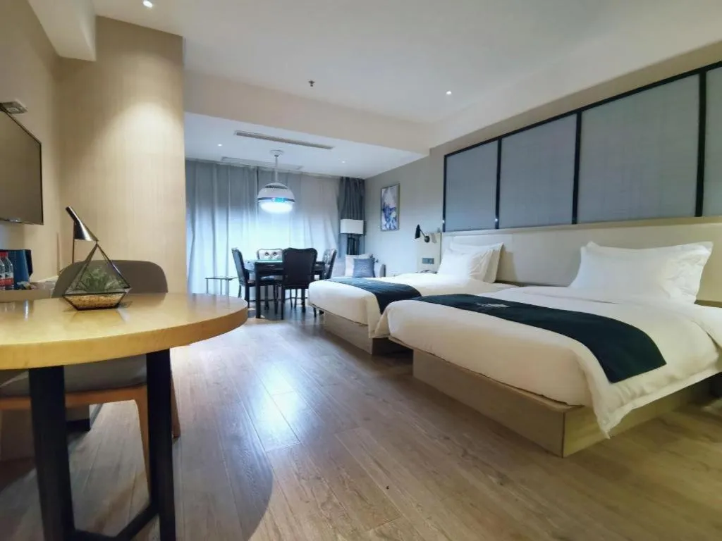 Bed in Echarm Hotel Xinyu Railway Station Baoshi Park