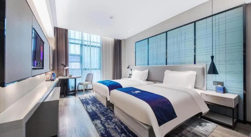 Bed in Echarm Hotel Xinyu Railway Station Baoshi Park