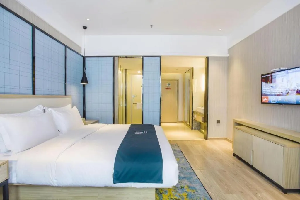 Bed in Echarm Hotel Xinyu Railway Station Baoshi Park