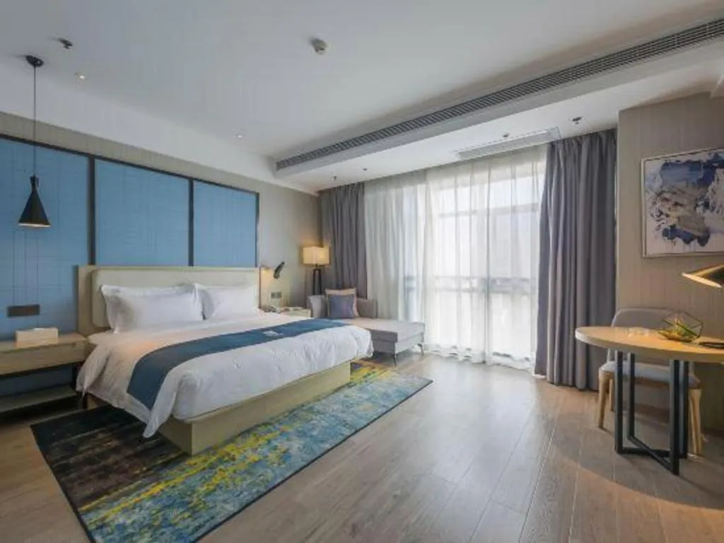 Bed in Echarm Hotel Xinyu Railway Station Baoshi Park