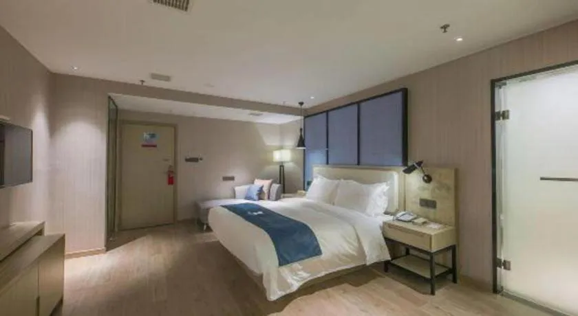 Bed in Echarm Hotel Xinyu Railway Station Baoshi Park