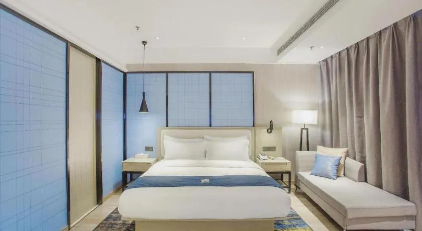 Bed in Echarm Hotel Xinyu Railway Station Baoshi Park