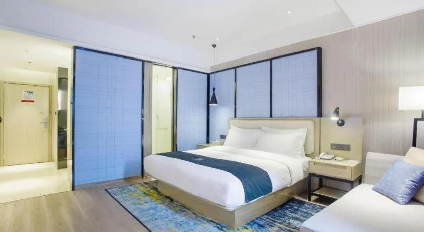 Bed in Echarm Hotel Xinyu Railway Station Baoshi Park