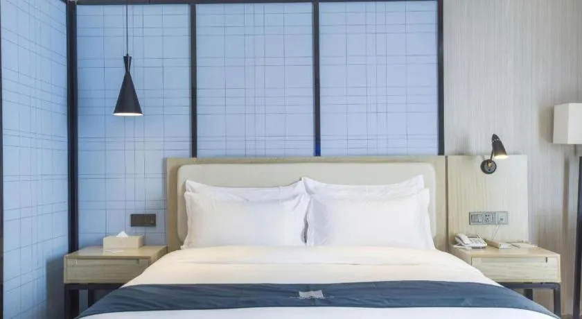 Bed in Echarm Hotel Xinyu Railway Station Baoshi Park