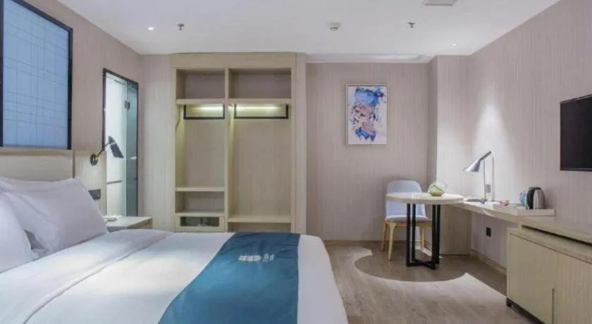 Bed in Echarm Hotel Xinyu Railway Station Baoshi Park