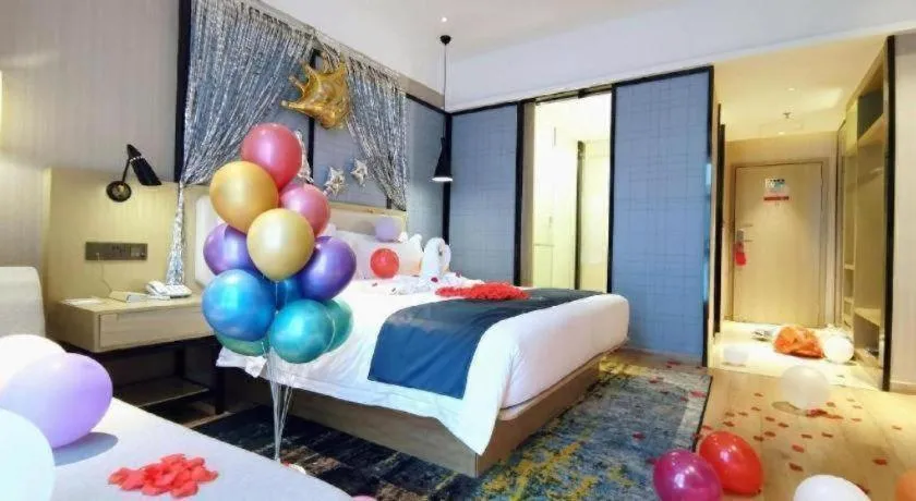 Bed in Echarm Hotel Xinyu Railway Station Baoshi Park