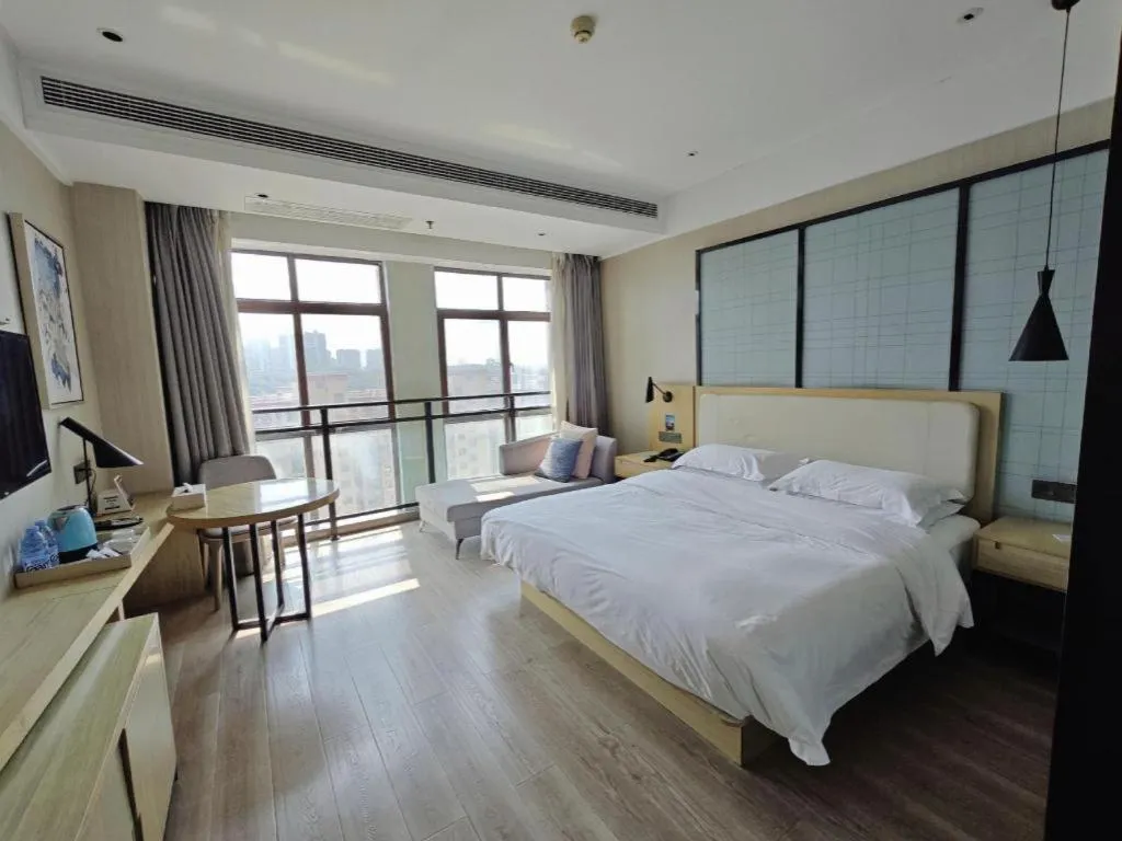 Bed in Echarm Hotel Xinyu Railway Station Baoshi Park