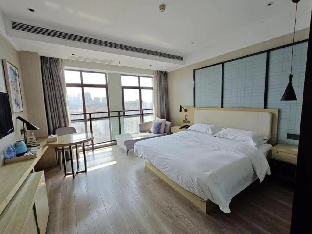 Bed in Echarm Hotel Xinyu Railway Station Baoshi Park
