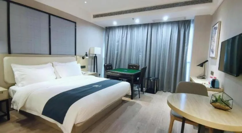 Bed in Echarm Hotel Xinyu Railway Station Baoshi Park