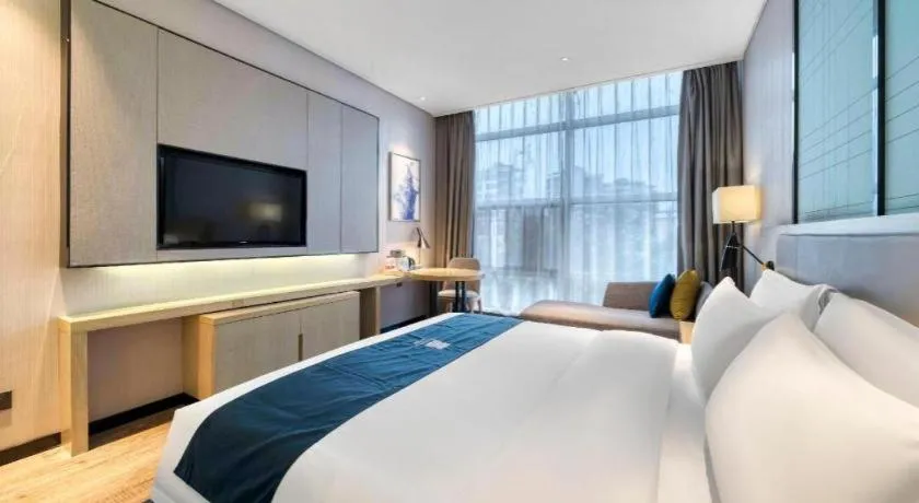 Bed in Echarm Hotel Nanjing Jiangning Tianyin Avenue Metro Station