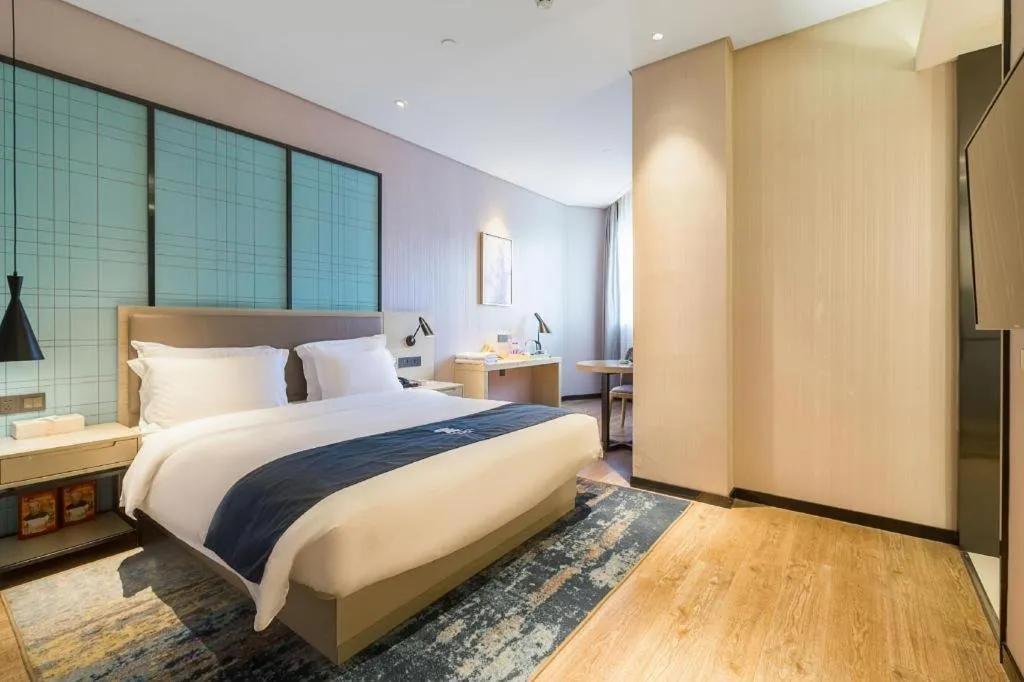 Bed in Echarm Hotel Nanjing Jiangning Tianyin Avenue Metro Station